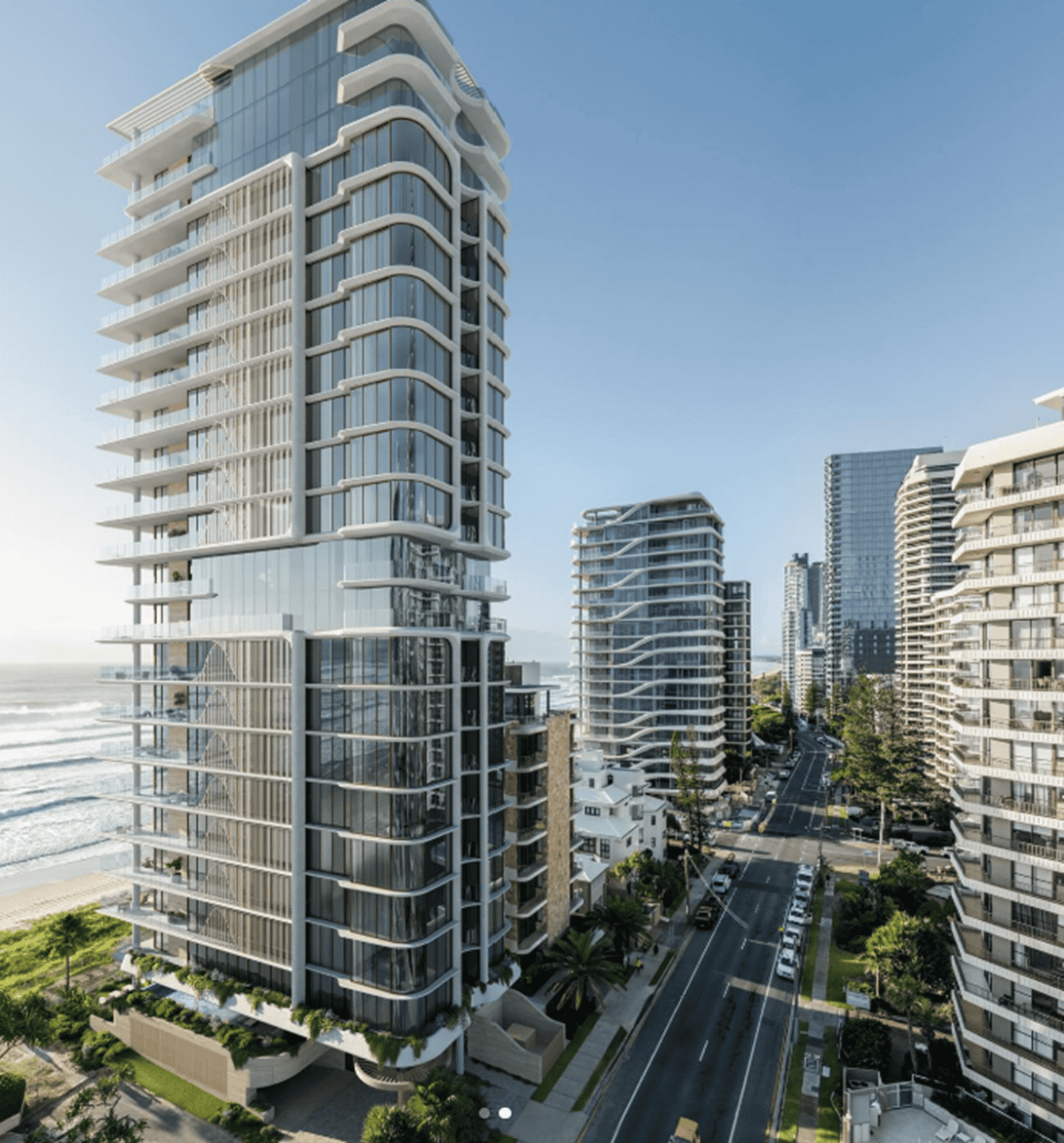 Modern coastal skyscrapers with glass facades and dynamic architecture in a city setting.