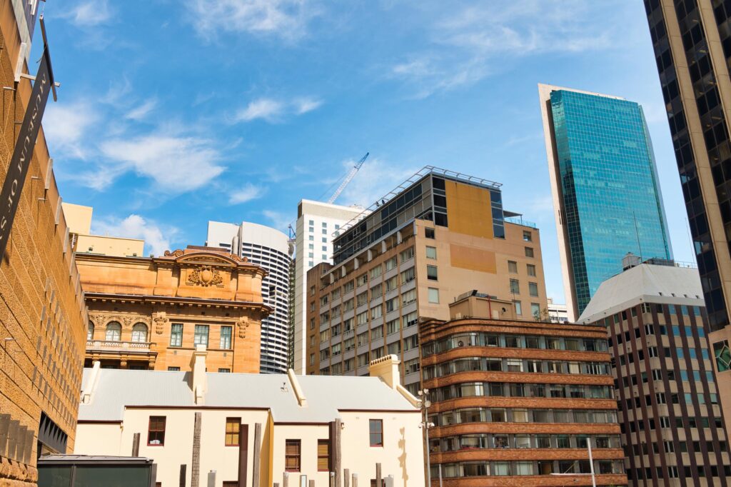 Modern city skyline with skyscrapers and historic buildings in downtown, vibrant urban business district.
